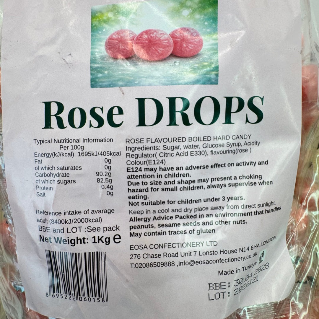 Back of a package of Eosa Confectionery 'Rose Drops' showing product details, ingredients, nutritional information, barcode, and a small photo of pink rose-shaped candies.
