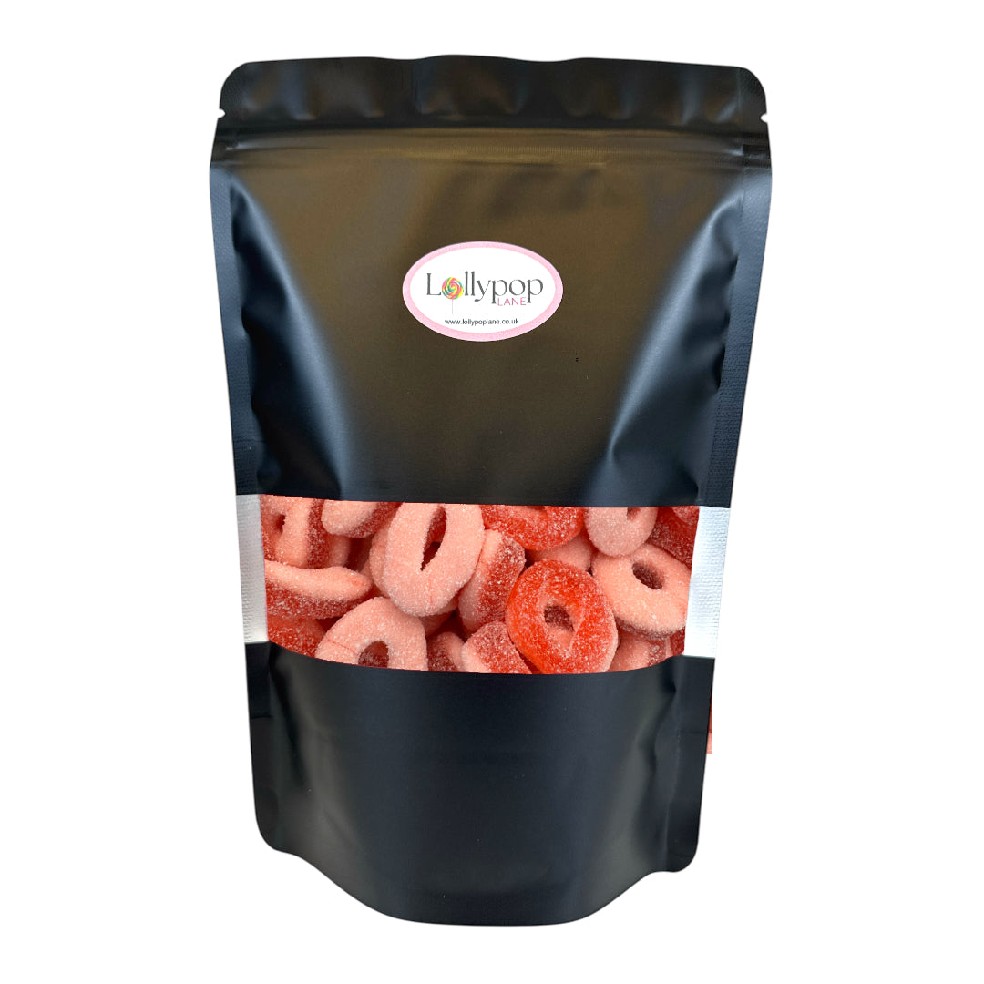 Lollypop Lane black food pouch filled with Park Lane Sour Strawberry Rings