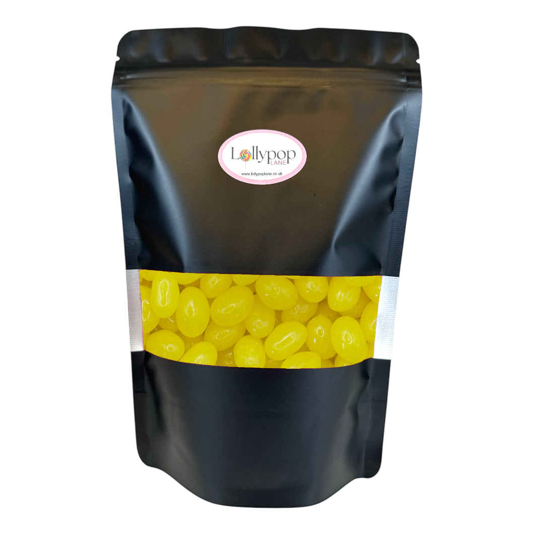 Black bag of yellow candies with Lollypop branding on a white background