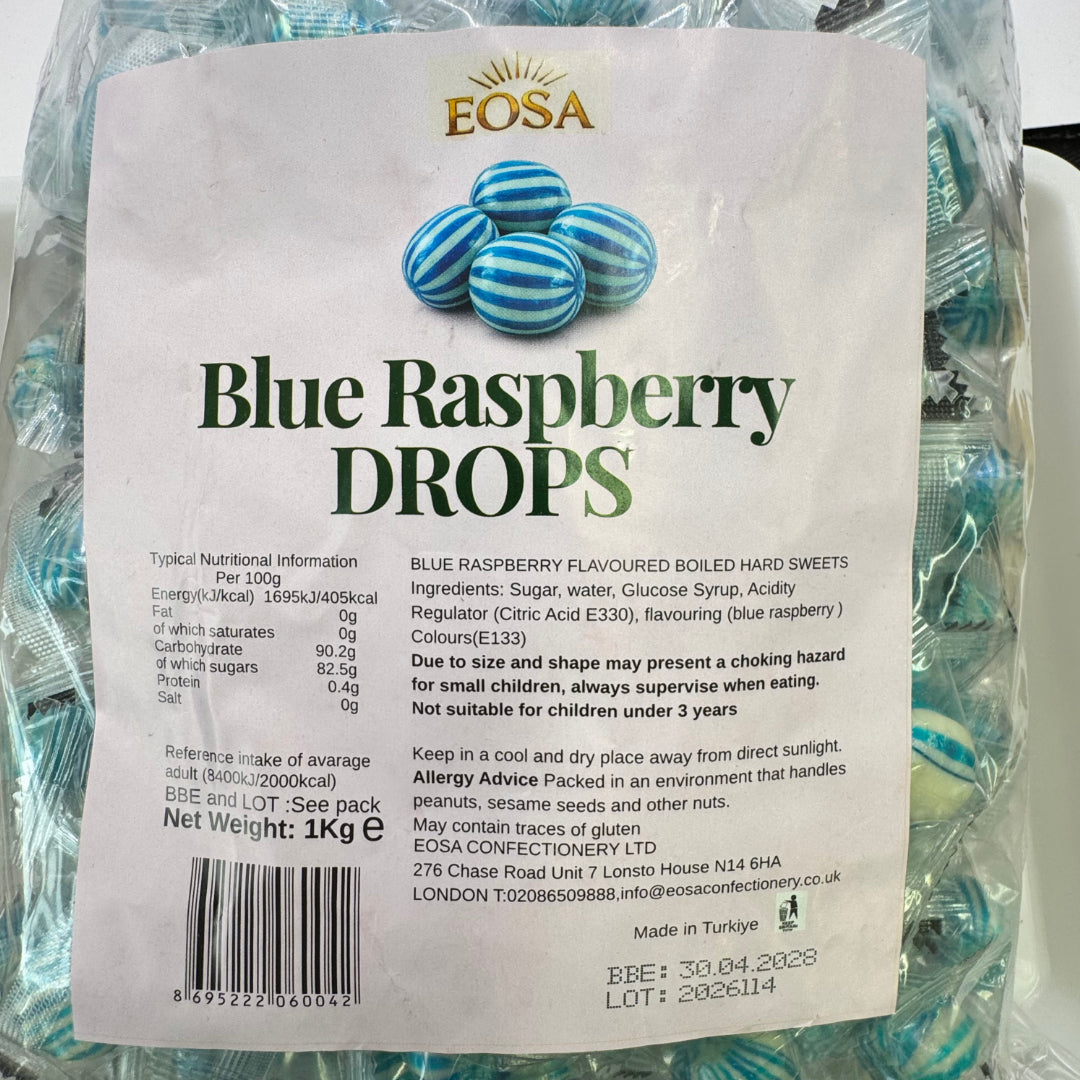 A 1kg bag of Eosa Blue Raspberry Drops, showing the back of the packaging with product details, ingredients, and a barcode on a clear plastic bag containing the green syrup.