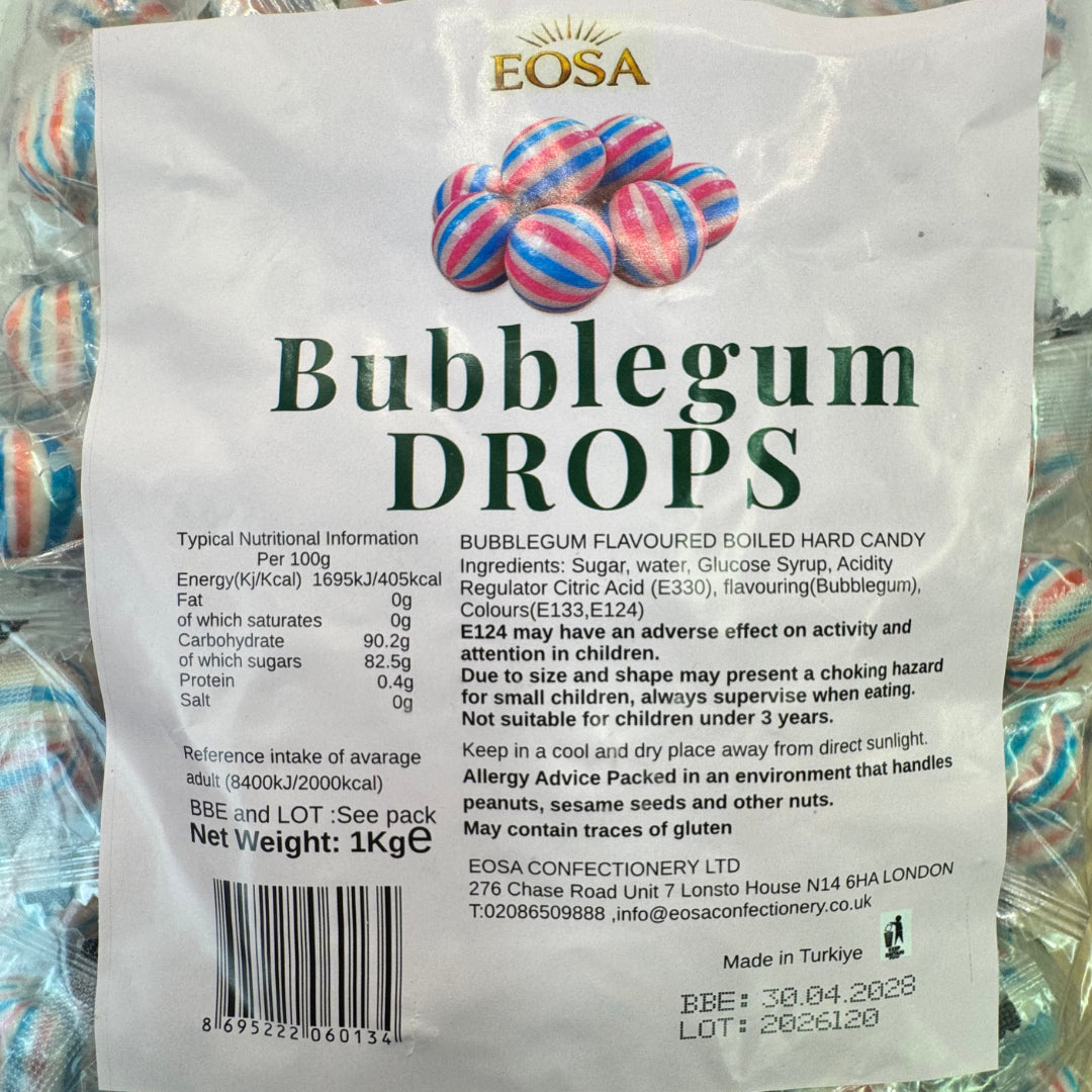 A close-up of a white product label for Eosa Bubblegum Drops, showing the brand name, product type, ingredients, nutritional information, and a barcode, with colorful bubblegum packaging visible in the background.