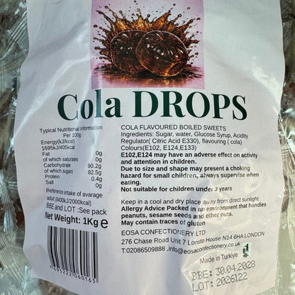 A close-up of a bag of Cola Drops cola-flavoured boiled sweets, showing the front packaging with product name, ingredients, nutritional information, barcode, and handling advice on a white background.