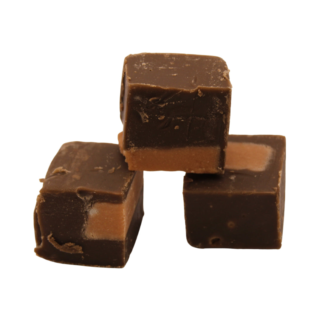Three pieces of The Fudge Factory Triple Chocolate Brownie stacked on a white background