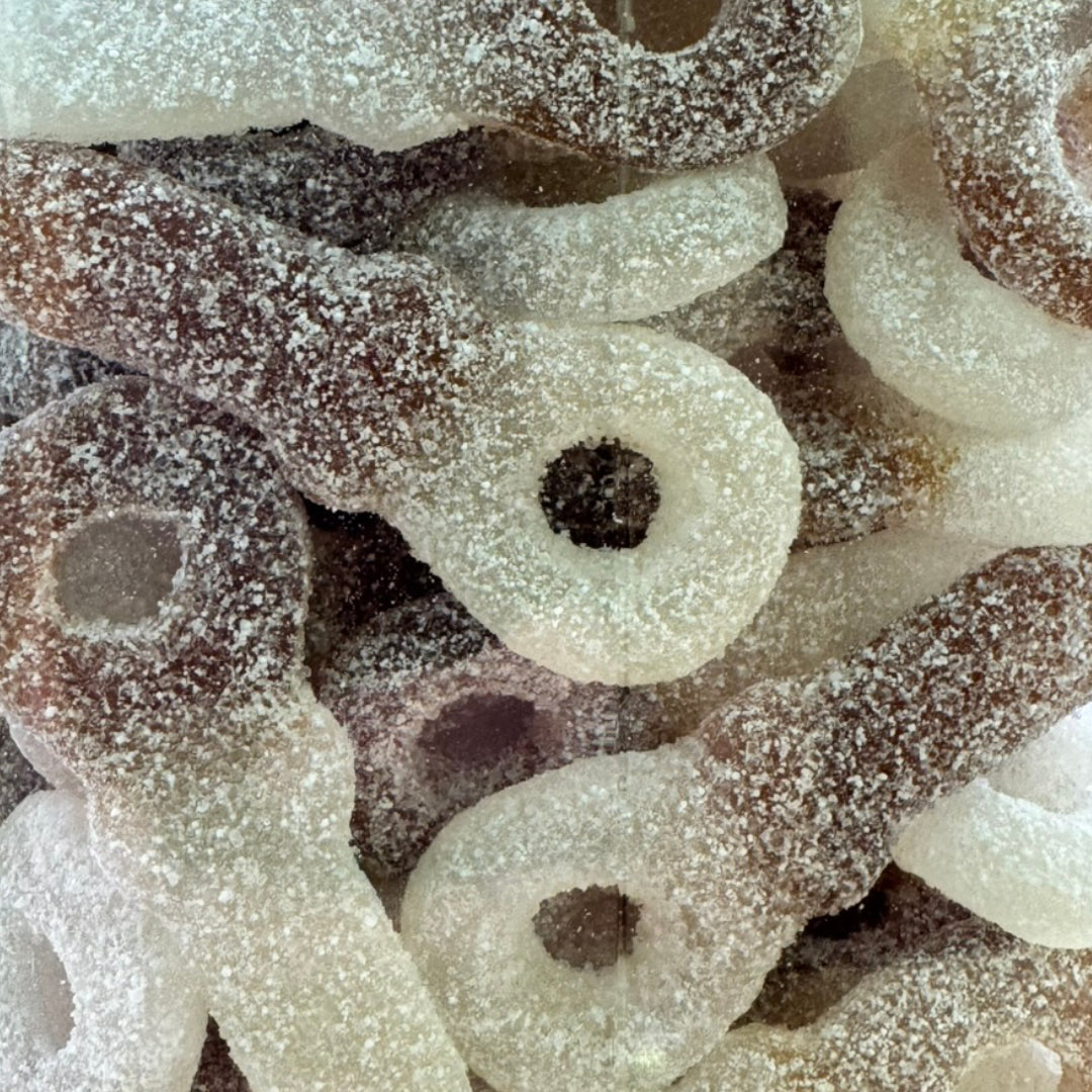 Close up view of Frisia Fizzy Cola Dummies sweets.