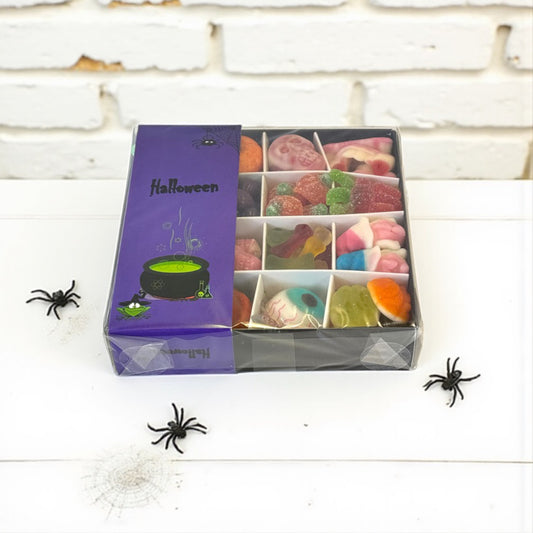 Lollypop Lane halloween gift box filled with spooky shaped sweets surrounded by spiders.
