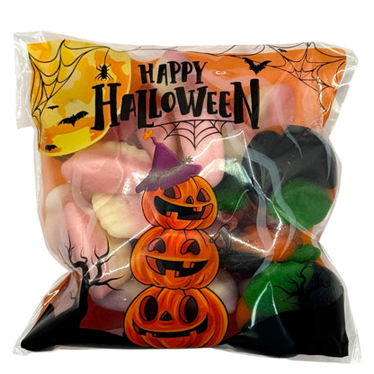 Halloween-themed candy bag with pumpkins and ghost shapes.