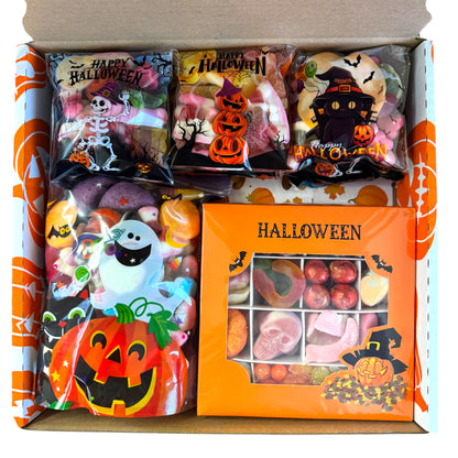 Lollypop Lane Halloween selection box showing the contents inside. One gift box, one 400g pouch and six 100g pouches filled with spooky sweet treats.