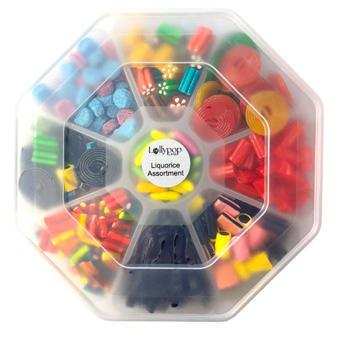Lollypop Lane sweet platter (with the lid on) filled with an assortment of liquorice sweets on a white background.