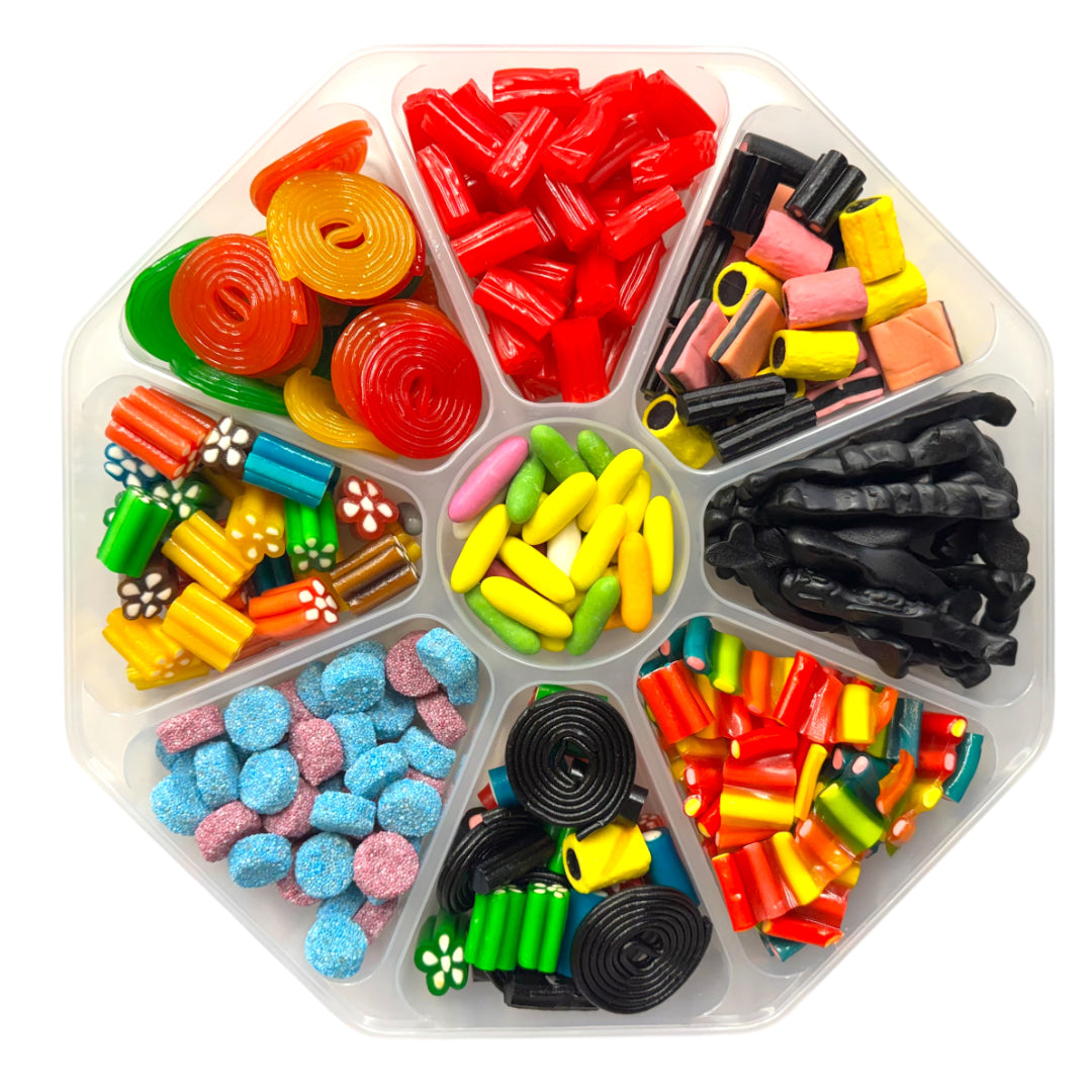 Lollypop Lane sweet platter (with the lid on) filled with an assortment of liquorice sweets on a white background.