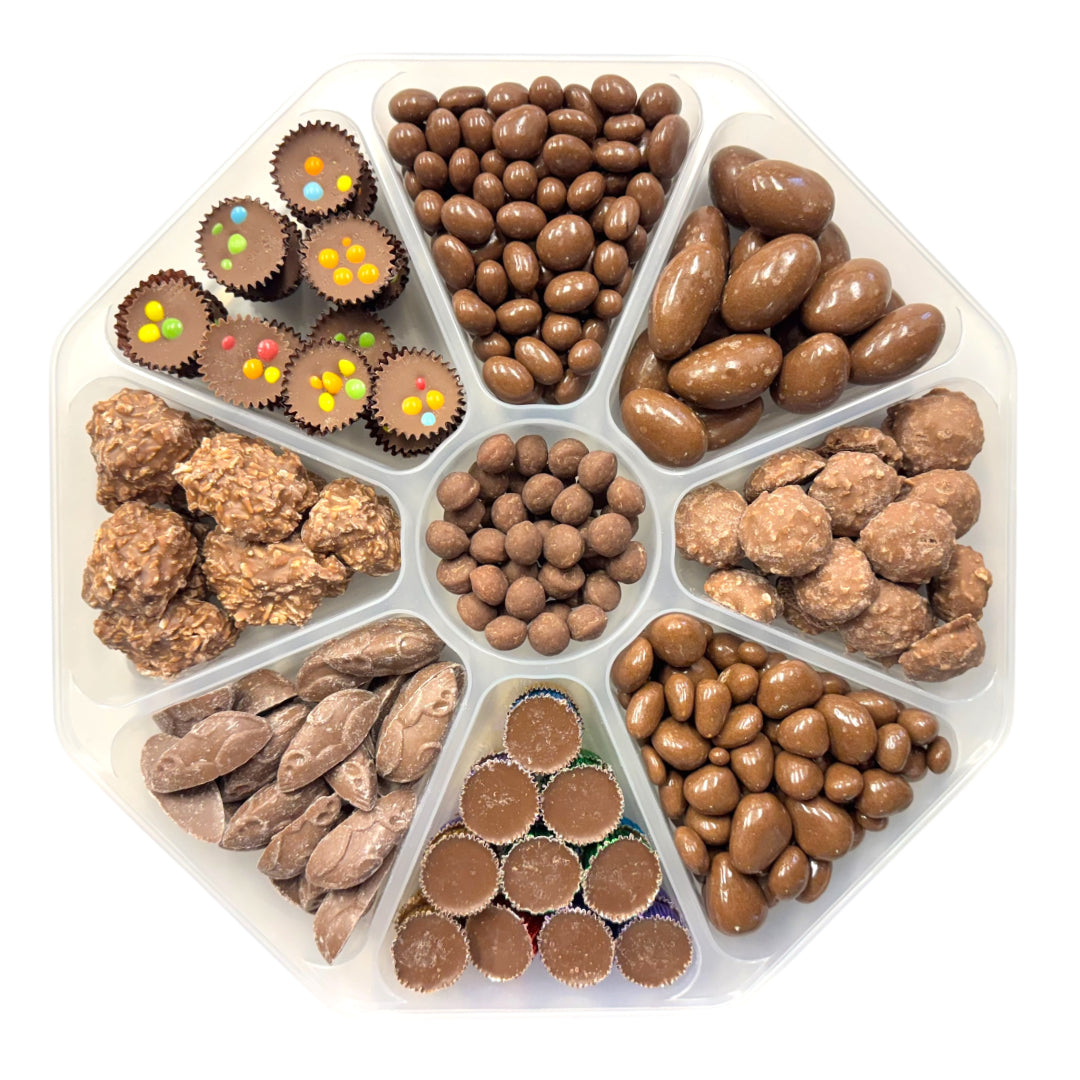 Lollypop Lane platter filled with an assortment of milk chocolate sweets with the lid off on a white background.