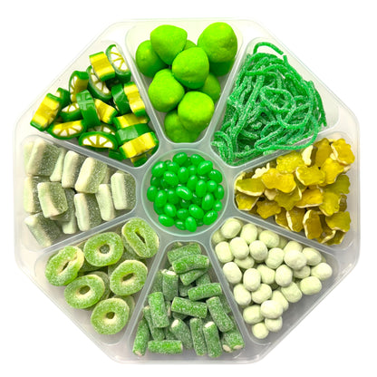 Lollypop Lane sweet platter filled with a selection of green sweets on a white background.