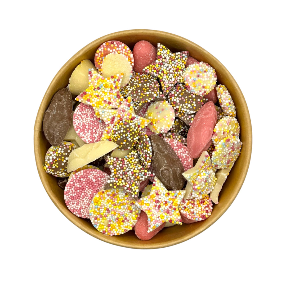 Lollypop Lane sweet bowl filled with a selection of chocolate sweets on a white background.