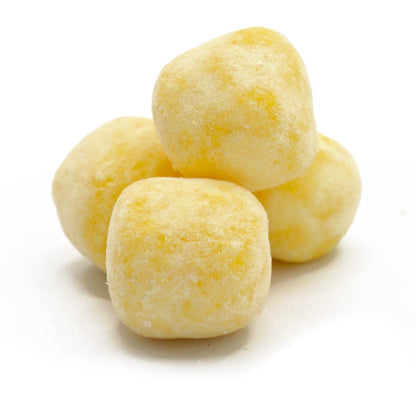 Four lemon bon bon sweets on a white background