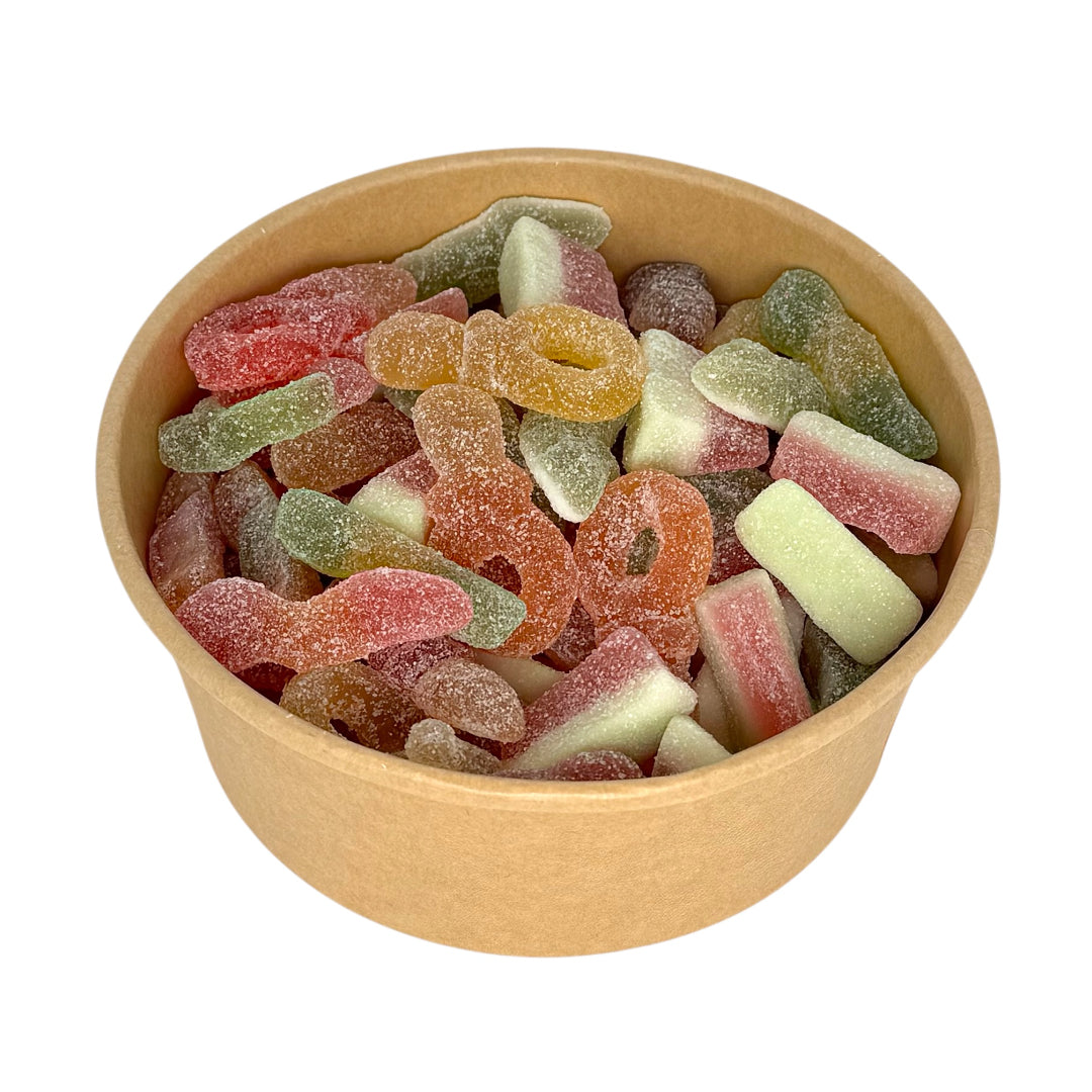 Food bowl filled with colourful gummy candies on a white background