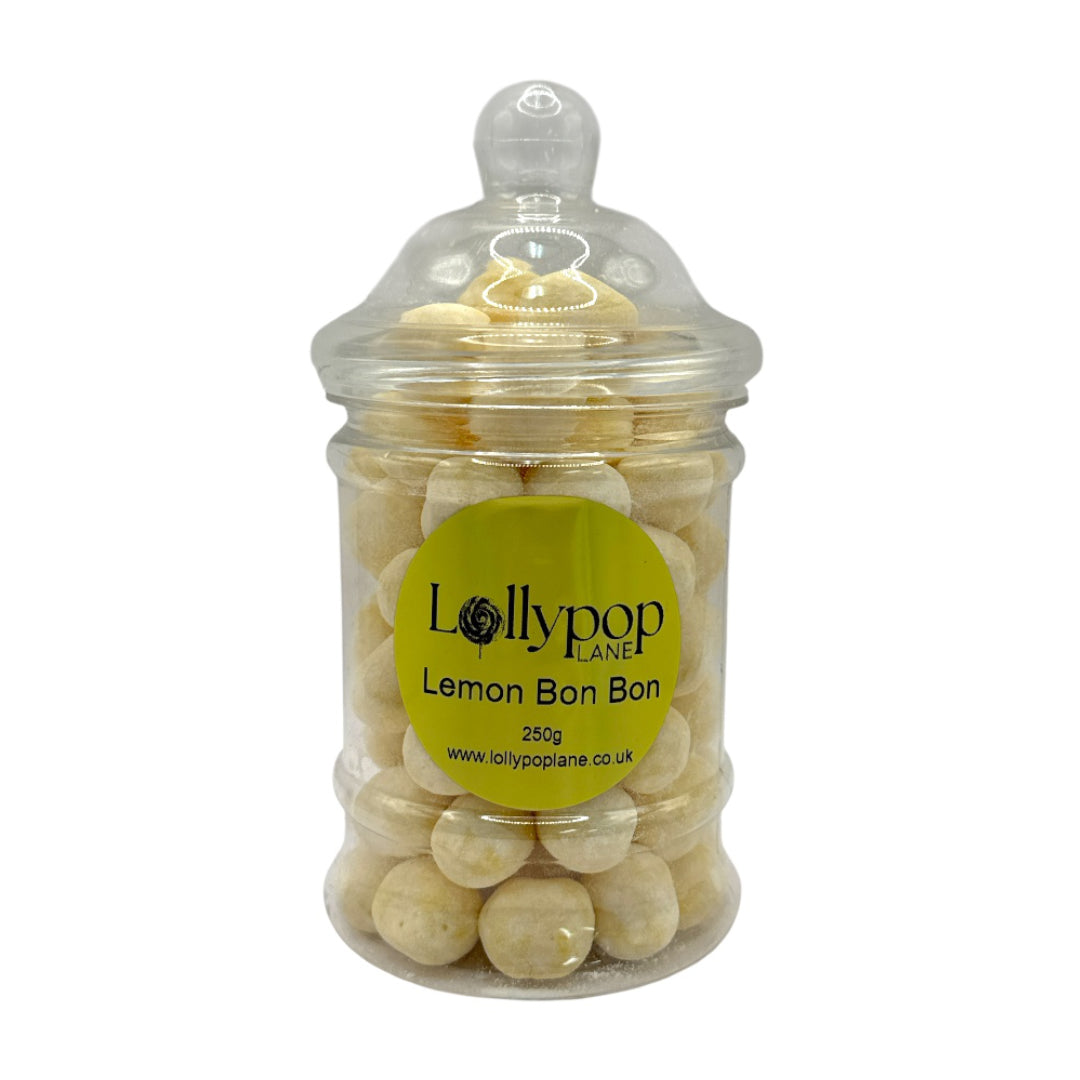 Jar of lemon bonbons with a clear lid and Lollypop Lane label on a white background