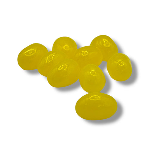 Yellow jelly beans on a white background