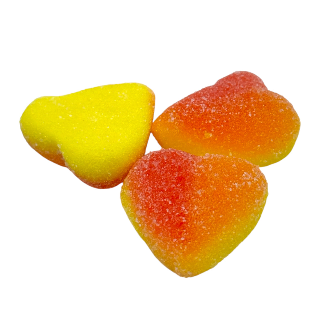 Three Candycrave Fizzy Peach Hearts on a white background