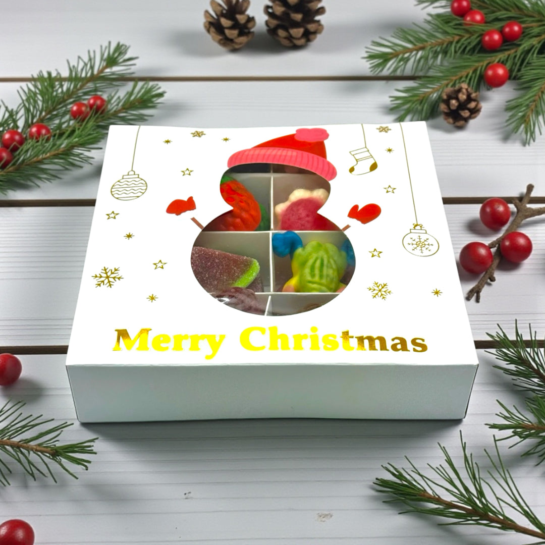 Lollypop Lane Christmas gift box containing jelly filled sweets. The background features a rustic table and Christmas decor.