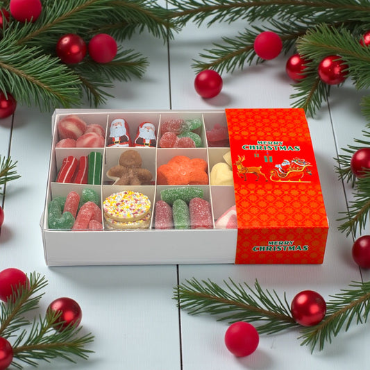 Christmas Gift Box with Red Sleigh Logo Filled with Seasonal Sweets. The background features a rustic wooden table and Christmas decor.